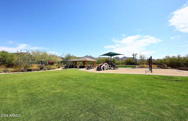 view of yard featuring a gazebo and a playground