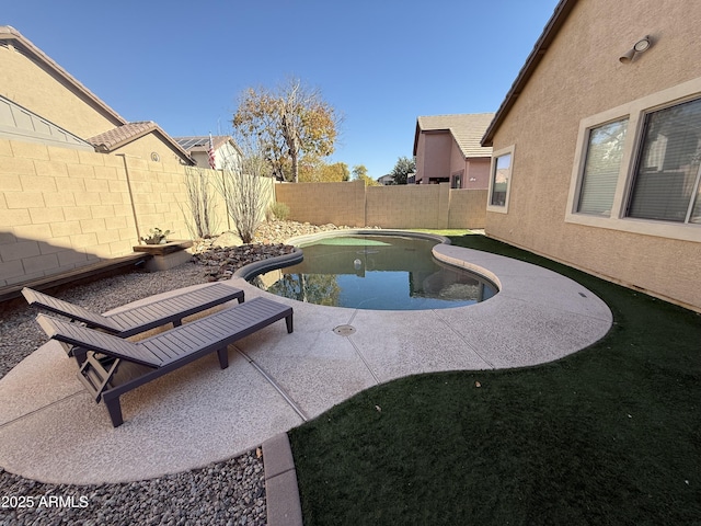 view of pool featuring a patio area, a fenced backyard, and a fenced in pool