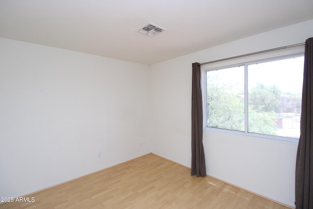 17606 N 17th Pl Unit 1096, Phoenix, AZ 85022 - unfurnished room with plenty of natural light and light wood-style flooring