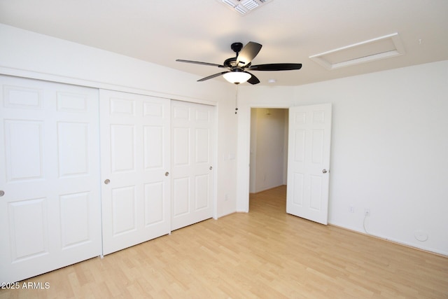 17606 N 17th Pl Unit 1096, Phoenix, AZ 85022 - unfurnished bedroom with attic access, light wood finished floors, a closet, and ceiling fan
