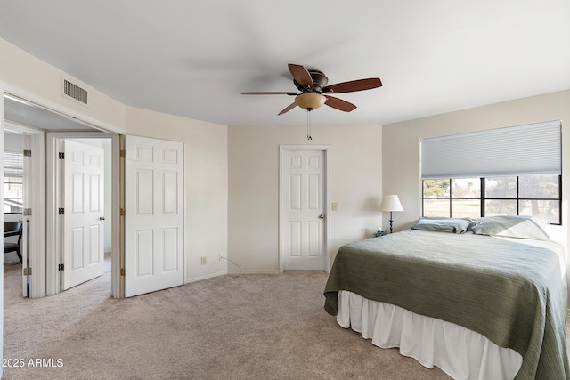 carpeted bedroom with ceiling fan