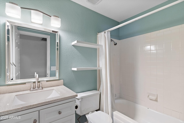 full bathroom with shower / tub combo with curtain, vanity, and toilet