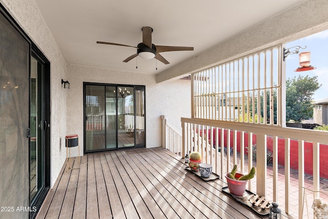 wooden terrace featuring ceiling fan