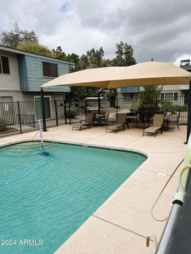 view of pool featuring a patio area