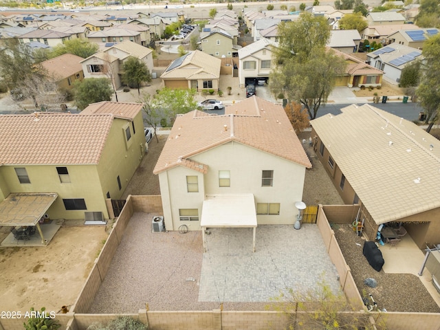 birds eye view of property with a residential view