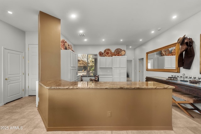 7145 E Cuernavaco Way, Gold Canyon, AZ 85118 - kitchen featuring white fridge, recessed lighting, a peninsula, white cabinetry, and light stone countertops
