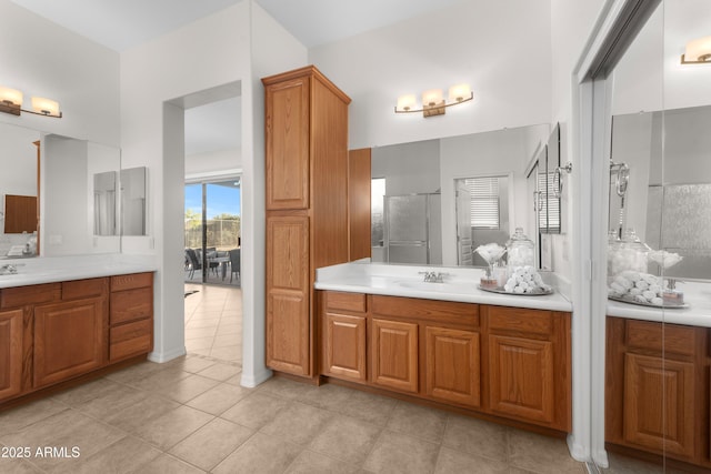 7145 E Cuernavaco Way, Gold Canyon, AZ 85118 - bathroom featuring a stall shower, two vanities, a sink, and tile patterned flooring