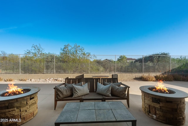 7145 E Cuernavaco Way, Gold Canyon, AZ 85118 - view of patio / terrace with a fire pit and a fenced backyard