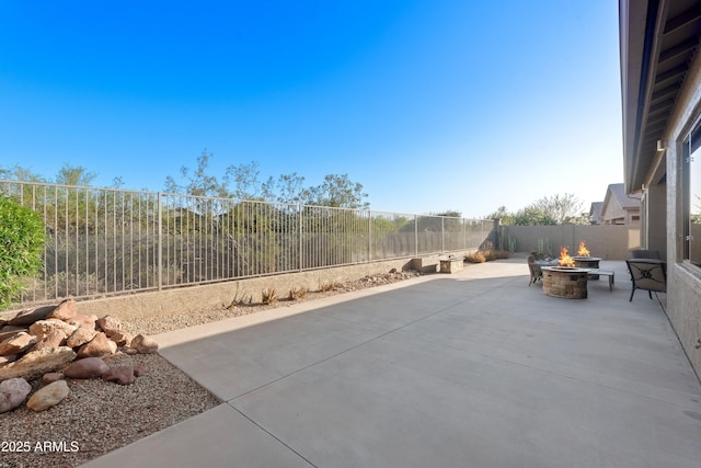7145 E Cuernavaco Way, Gold Canyon, AZ 85118 - view of patio / terrace featuring an outdoor fire pit and a fenced backyard