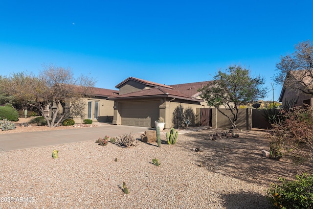 7145 E Cuernavaco Way, Gold Canyon, AZ 85118 - single story home with concrete driveway, stucco siding, fence, and a garage