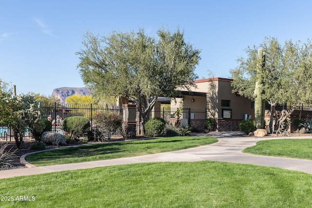 7145 E Cuernavaco Way, Gold Canyon, AZ 85118 - surrounding community with a mountain view, fence, and a lawn
