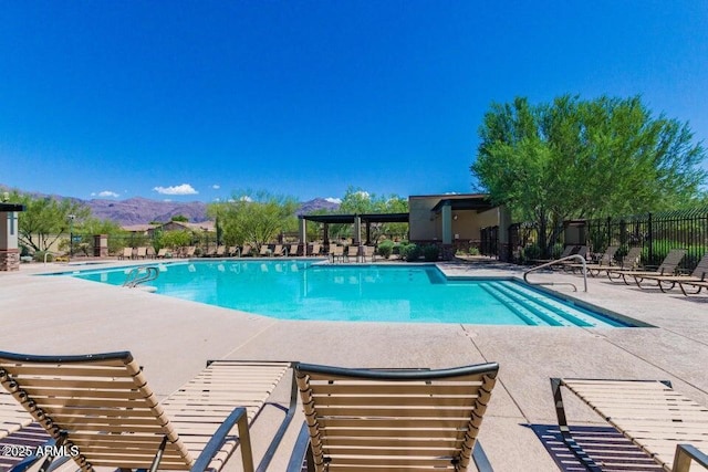 7145 E Cuernavaco Way, Gold Canyon, AZ 85118 - community pool featuring a patio, fence, and a mountain view