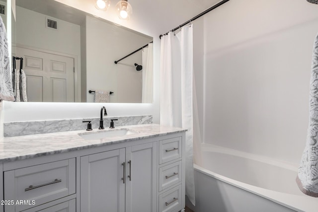 bathroom with vanity and shower / bathtub combination with curtain