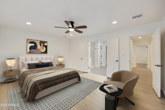 bedroom featuring ceiling fan and light hardwood / wood-style flooring