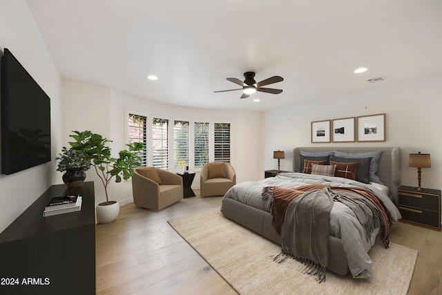 bedroom featuring ceiling fan and light wood-type flooring