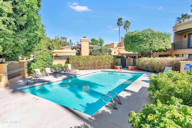 view of swimming pool featuring a patio area