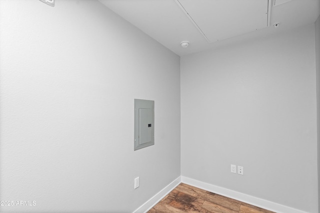 2511 W Queen Creek Rd Unit 116, Chandler, AZ 85248 - washroom with attic access, electric panel, baseboards, and wood finished floors