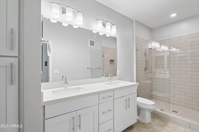 2511 W Queen Creek Rd Unit 116, Chandler, AZ 85248 - bathroom with toilet, a stall shower, double vanity, and tile patterned floors