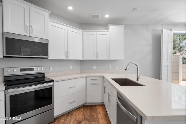 2511 W Queen Creek Rd Unit 116, Chandler, AZ 85248 - kitchen with stainless steel appliances, a sink, light countertops, and recessed lighting
