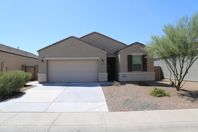 single story home featuring a garage