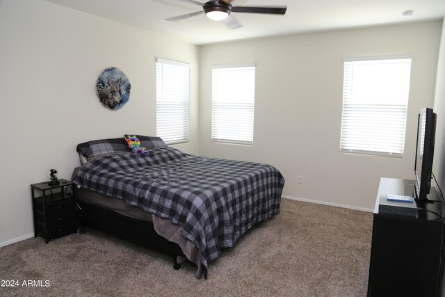 carpeted bedroom featuring ceiling fan