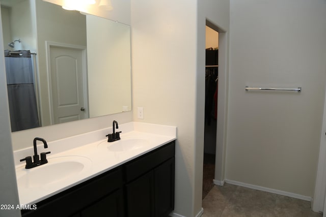 bathroom with vanity and tile patterned floors