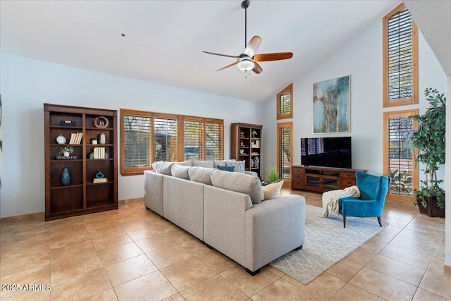 living room featuring light tile patterned floors, ceiling fan, and high vaulted ceiling