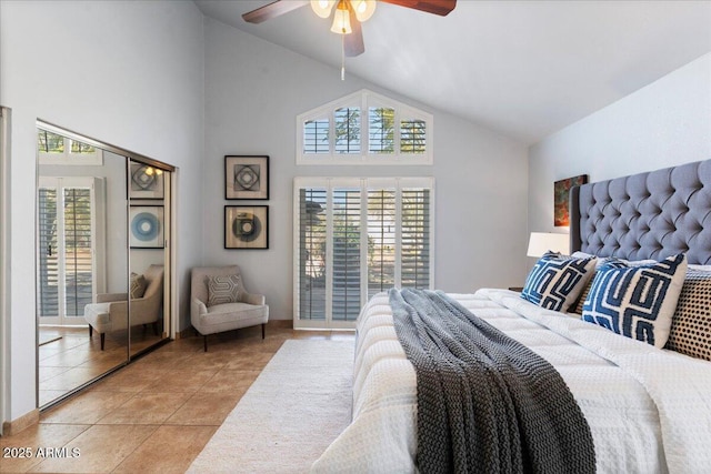 bedroom featuring high vaulted ceiling, ceiling fan, and light tile patterned floors