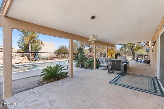 view of patio / terrace with a fenced in pool and outdoor dining space