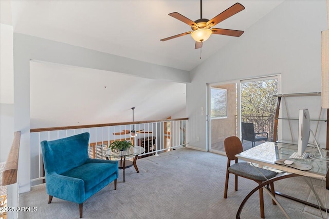 office space featuring vaulted ceiling, a ceiling fan, and light colored carpet