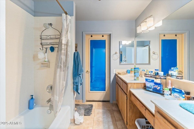 full bath with tile patterned floors, shower / bathtub combination with curtain, and vanity