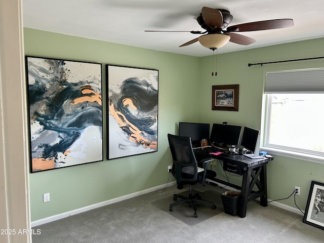 office with a ceiling fan, baseboards, and carpet flooring