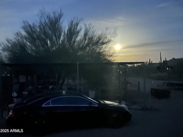 view of parking at dusk