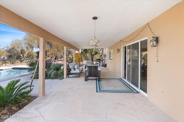 view of patio / terrace with an outdoor pool