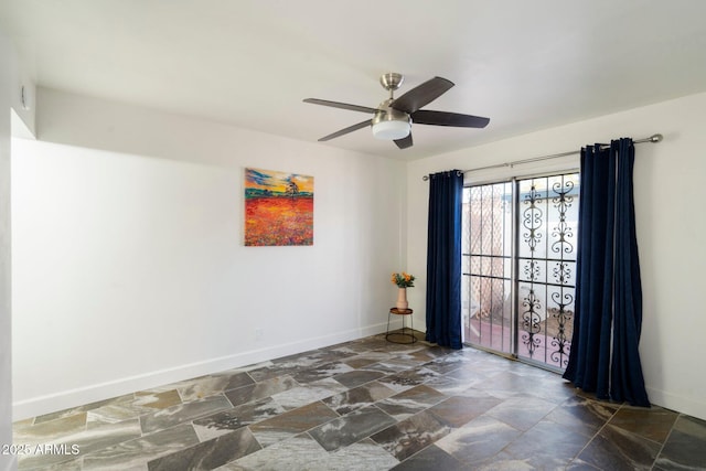 unfurnished room with ceiling fan