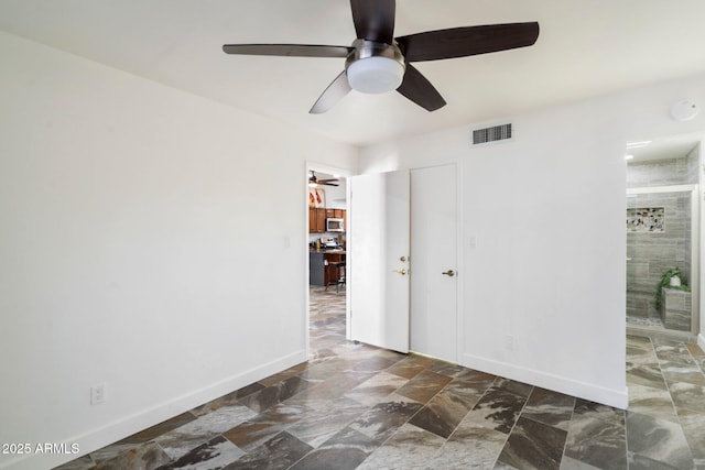 interior space featuring ceiling fan