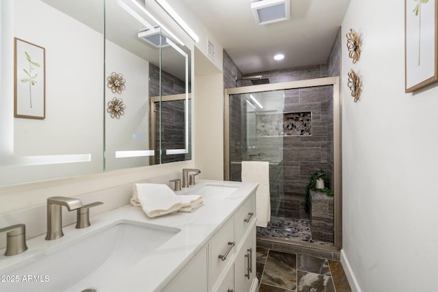 bathroom with an enclosed shower and vanity