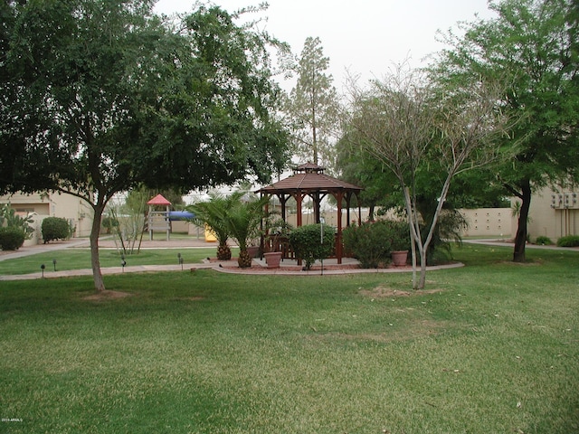 view of property's community featuring a gazebo and a yard