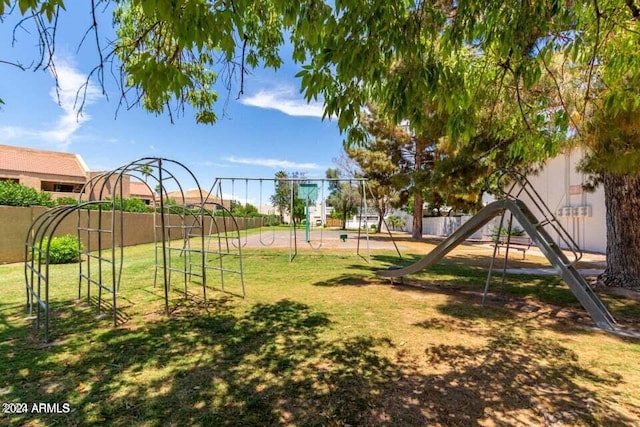 view of playground with a yard