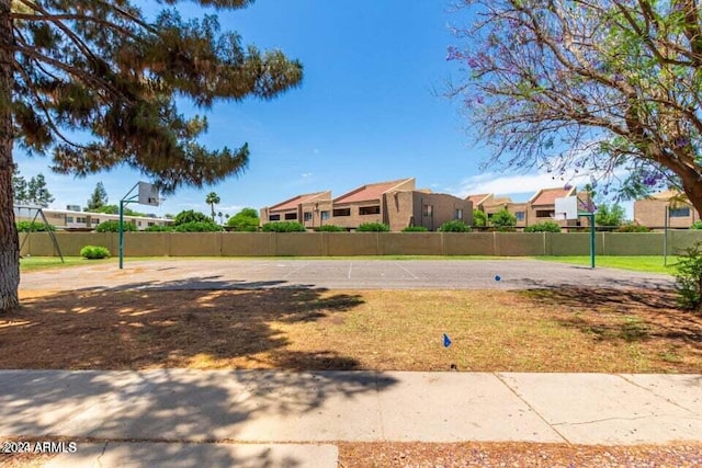 view of yard featuring basketball court