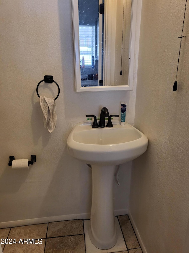 bathroom featuring tile patterned floors and sink