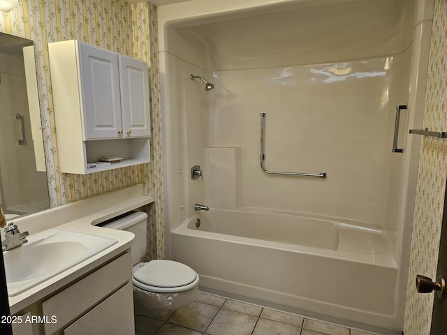 full bath featuring tile patterned flooring, toilet, vanity, washtub / shower combination, and wallpapered walls