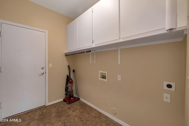 laundry area with hookup for a gas dryer, hookup for a washing machine, electric dryer hookup, and cabinets