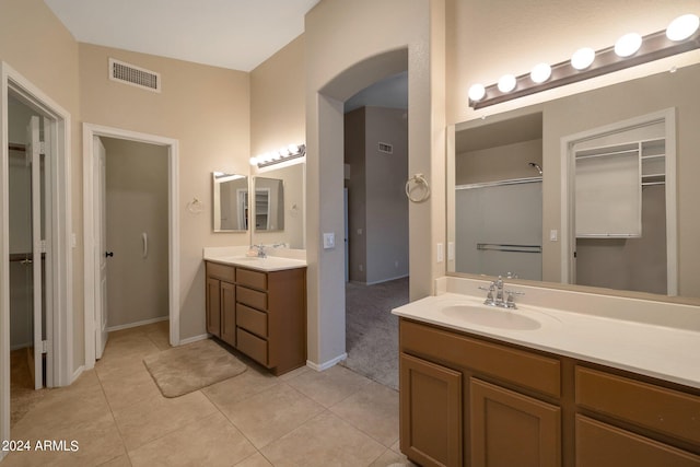 bathroom featuring tile patterned flooring and vanity