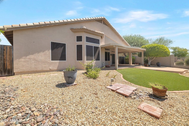 back of house with a patio area