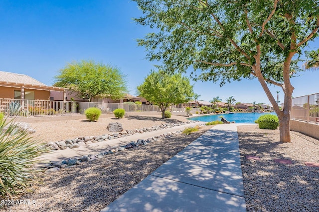 view of yard with a fenced in pool and a patio area