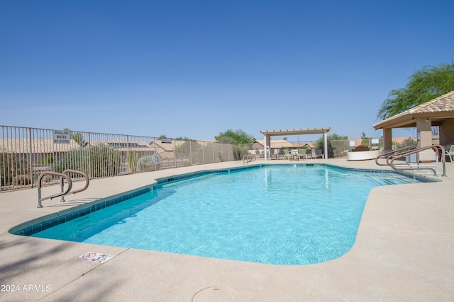 view of pool with a pergola and a patio area