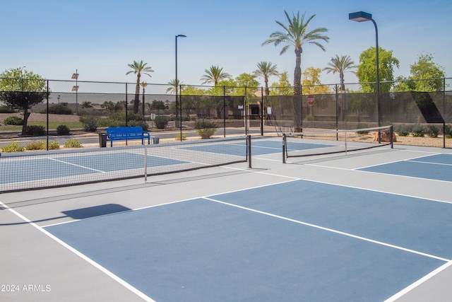 view of tennis court featuring basketball court