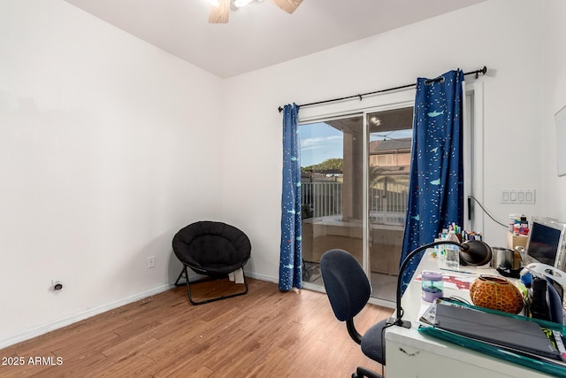 office area featuring light wood finished floors, ceiling fan, and baseboards