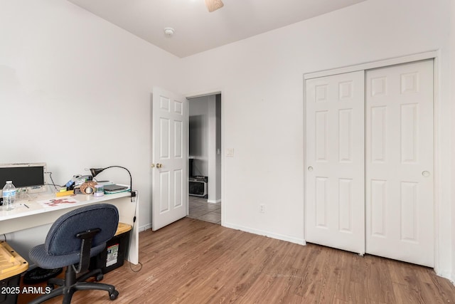 office featuring baseboards and light wood finished floors